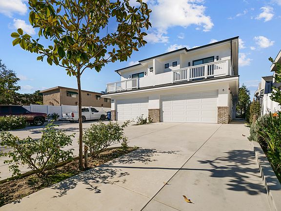 Welcome home! 2 car garage plus an additional parking space! Front Exterior landscaped with roses, bird of paradise, etc.
