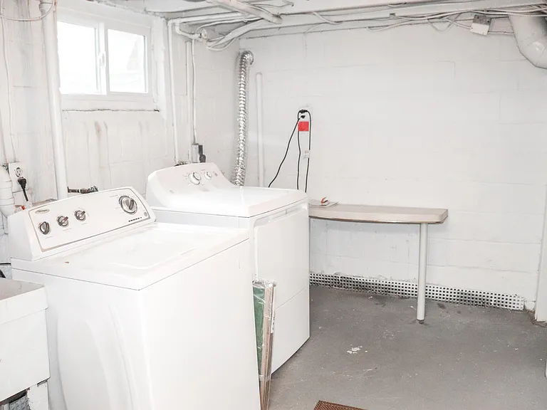 Utility room with washer and dryer