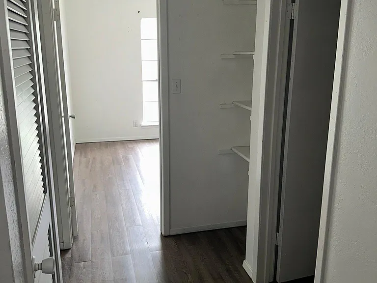 At the top of the stairs looking towards bedrooms