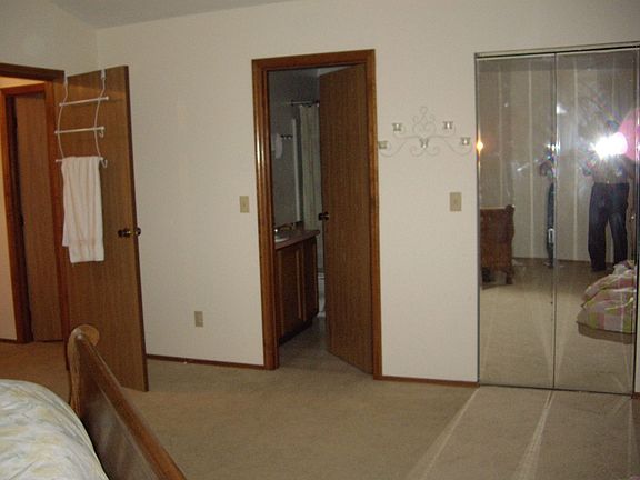 Master bedroom; behind mirros is the walk-in closet