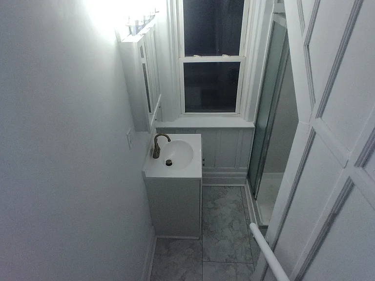 additional full bath with stand up shower, vanity with storage, new waterproof vinyl flooring