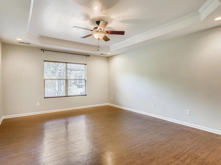 Large Primary Bedroom with trey ceiling on Main floor.