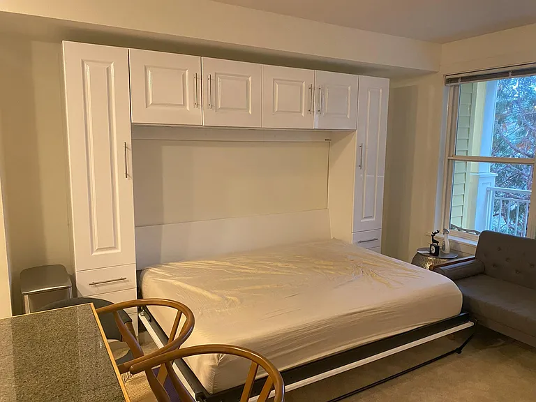 Wall bed (queen size) with ample cabinet storage