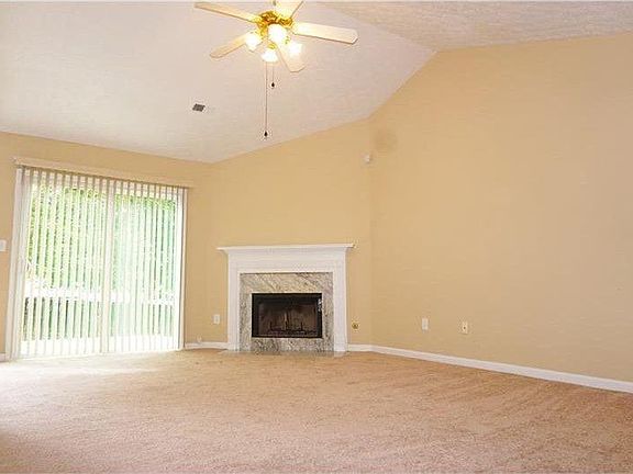 Living room looks out to backyard