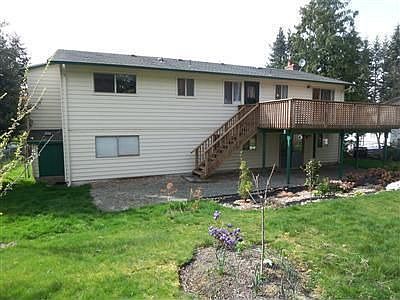 Fully fenced backyard has fruit trees and gardens. There is ample room for a h