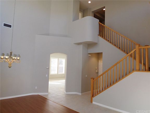 Front room and dining area with soaring ceilings a