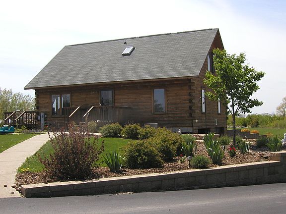 Front view with flower bed