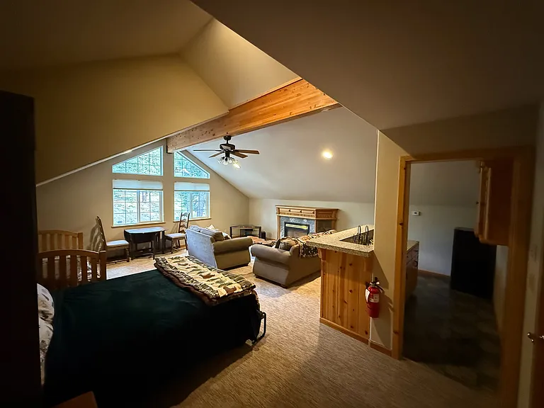 wet bar is to the right and this room has its own fireplace as well.
