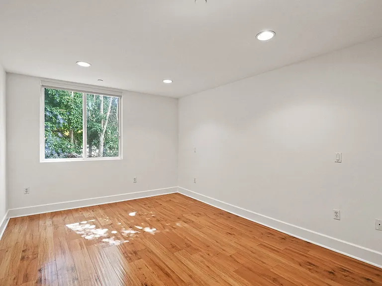 Bedroom with Vinyl Flooring and Window
