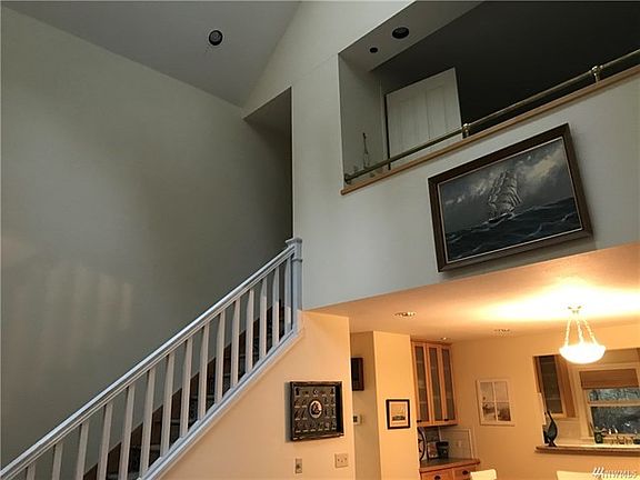 View from living area upwards of staircase to loft area