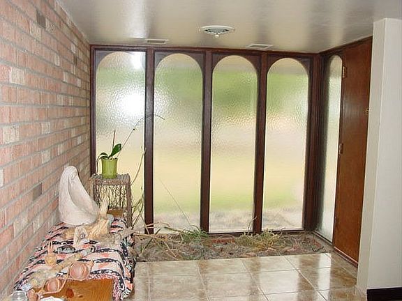Enter into your new home which you note has porcelain tile floors.