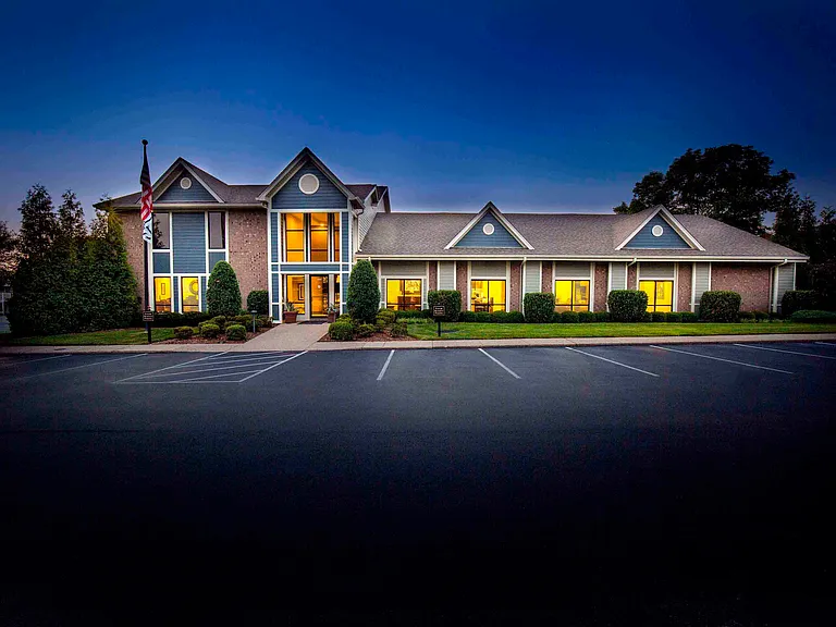 Leasing center and clubhouse entrance at dusk