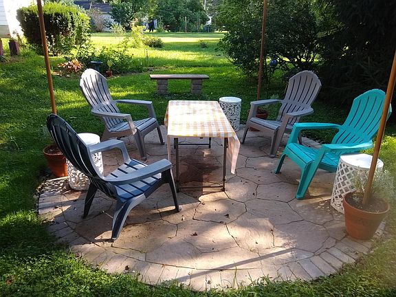 In-ground patio; classy string of lights surround it at night.