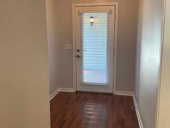 Front door entrance into foyer; Hardwood throughout with the exception of kitchen, laundry room and bathrooms which have ceramic tile.
