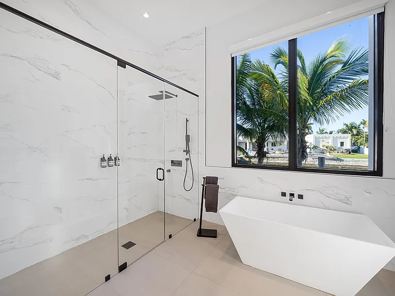 Primary bathroom with a spacious shower for two, three, or even four!?