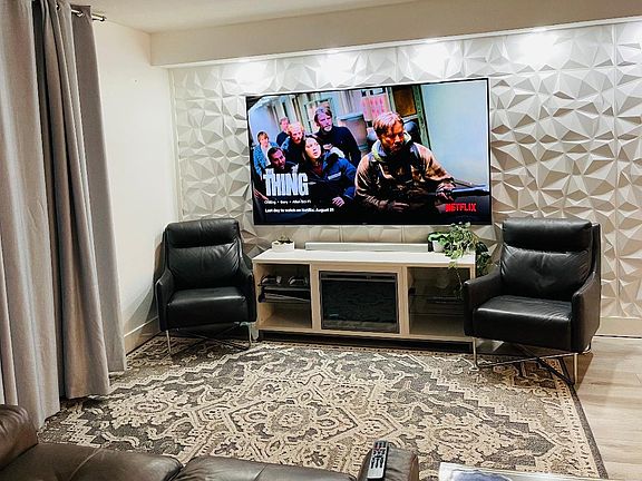 85" television visible from living room or a bedroom
