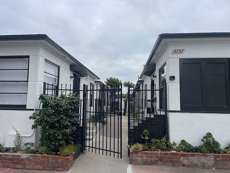 Looking from Adams Avenue through the front gate (wood fence is coming soon)