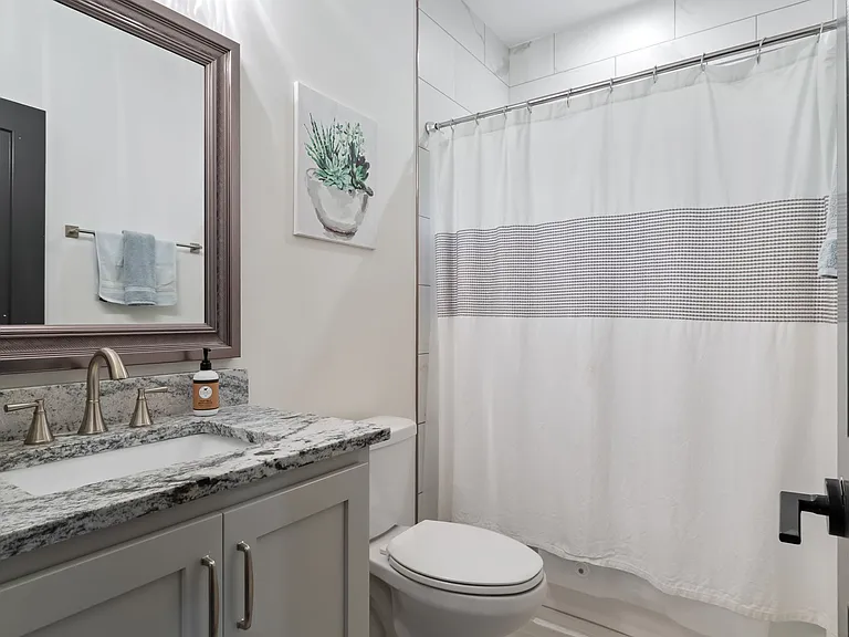A full bath is located next to the first floor office.