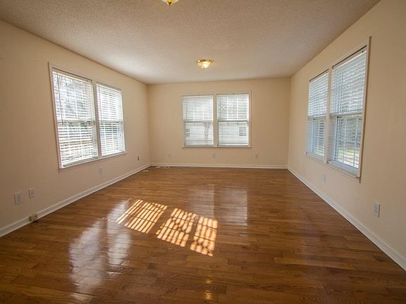 Family Room standing at french doors (note kitchen is behind you. Hardwood floors
