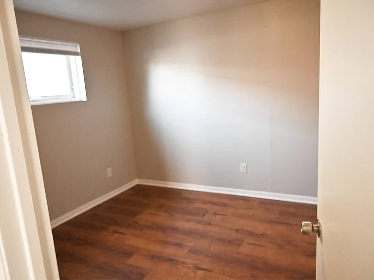 Natural light coming into a bedroom at Benson Crest Apartments.