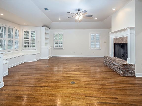 Den with nail-down hardwood floors