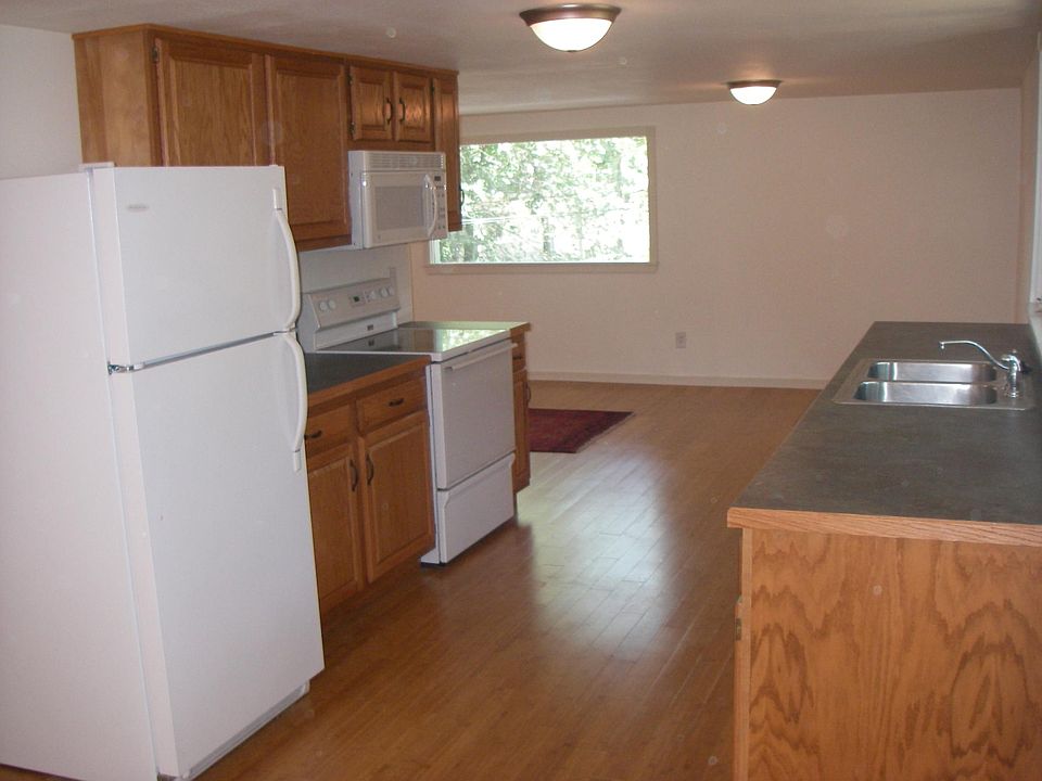 Older picture of kitchen with walls painted off-white.