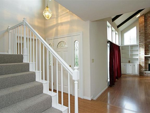 2-story entry welcomes guests. Step down into a SPACIOUS living area. Note: Carpet is only on the staircase and the 2nd floor.