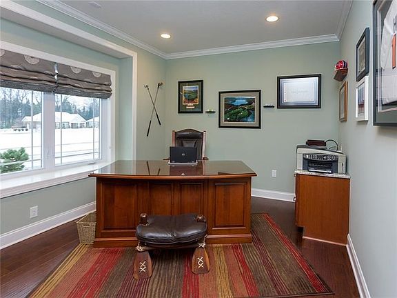 The first floor den has great built-in shelving and a window seat. This room offers stunning views of the neighborhood.