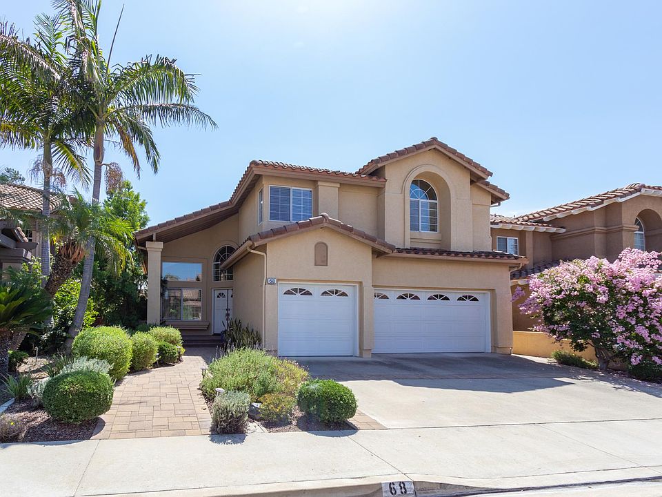Dazzling curb appeal with gorgeous landscape.