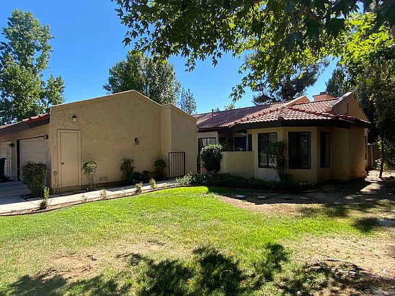 From the front yard again showing more of the 2 car garage,