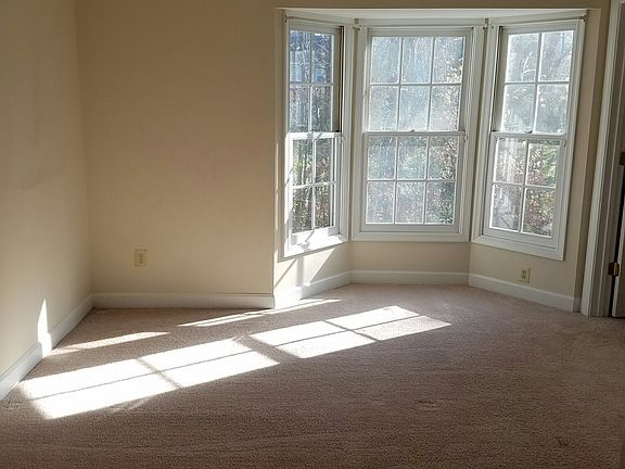Bedroom one with sunlight pouring in