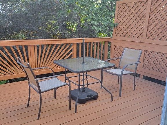 Enjoying dining alfresco in your private back deck! Table and chairs convey with the rental.