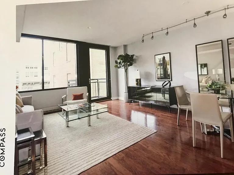 great room showing windows and door to small balcony