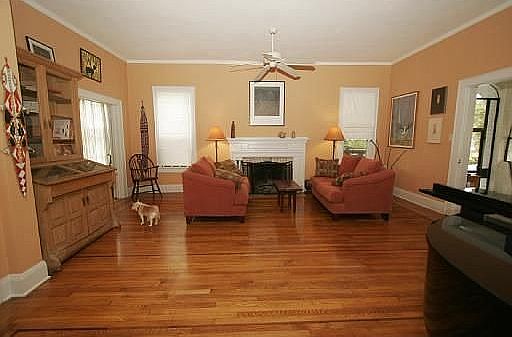 Living room with oak floors with mahogany inlaid