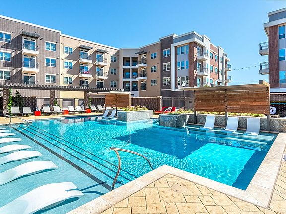 exterior pool with in-water lounge chairs