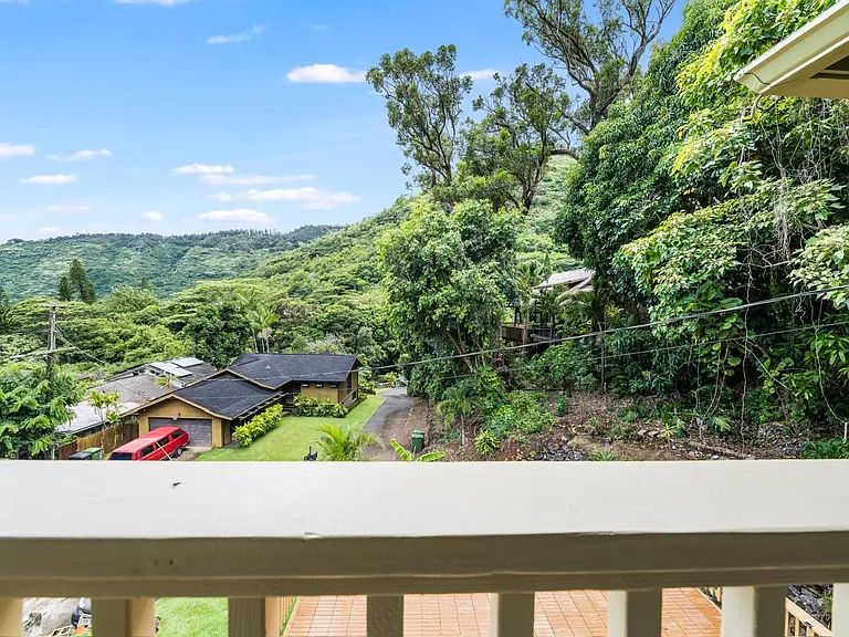 Lush valley and mountain views from the private balcony.