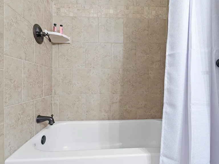 Shared full bath with tube on main floor