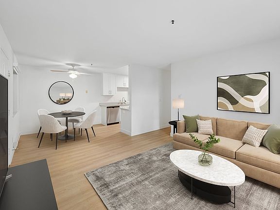 Renovated Package I living and dining area with hard surface flooring