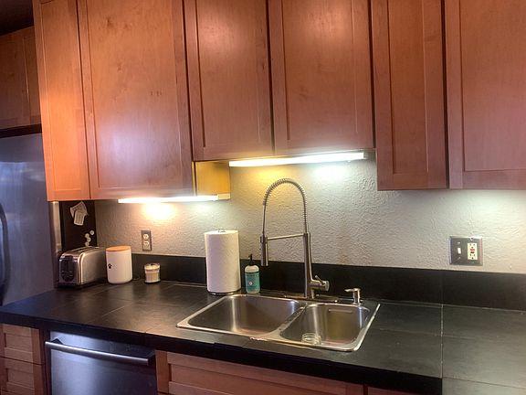 Kitchen with 42 inch cabinets and under cabinet lighting