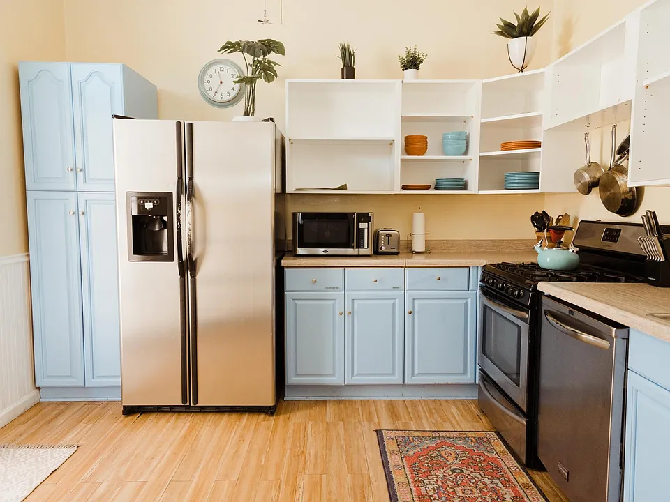 Spacious kitchen with a lot of storage and stainless steel appliances