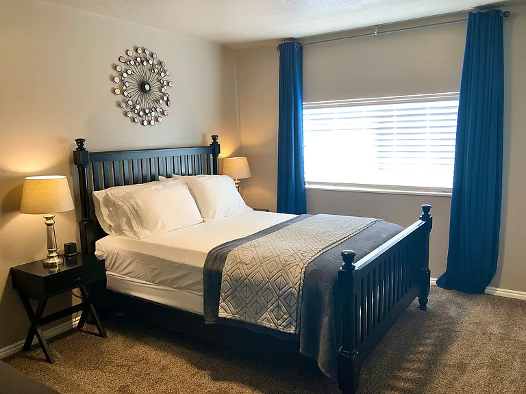 Master bedroom, with large window.