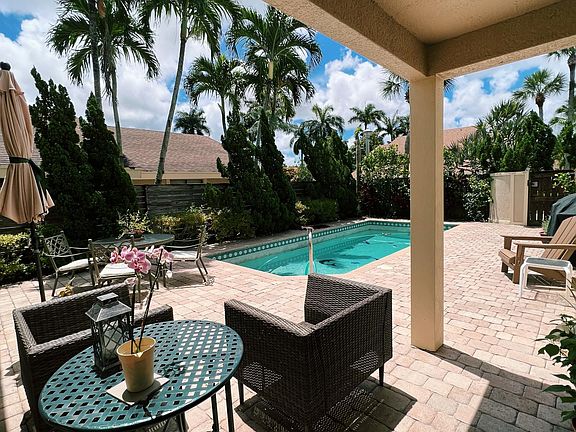 covered entry to front door and sliders to kitchen; spacious outdoor view