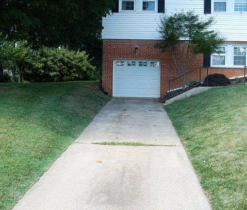 Garage with large driveway