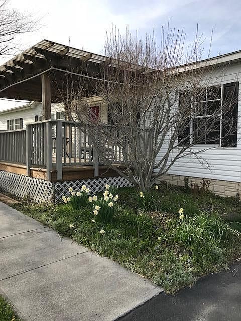 Front of House is facing South which gets full sun. Two large shade trees directly in front of the house and the cover over the front deck (16' x 8') give lots of shade on hot days.