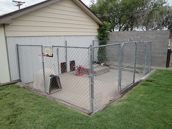 Dog pen in backyard