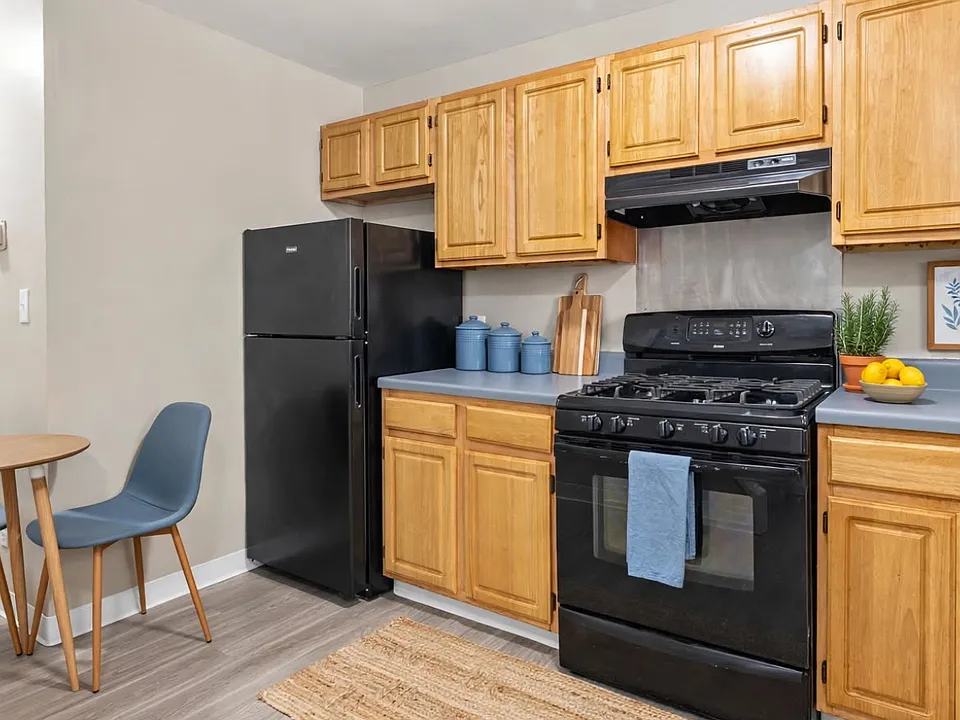 Fully equipped kitchen with a complete set of essential appliances, making meal preparation convenient and easy."