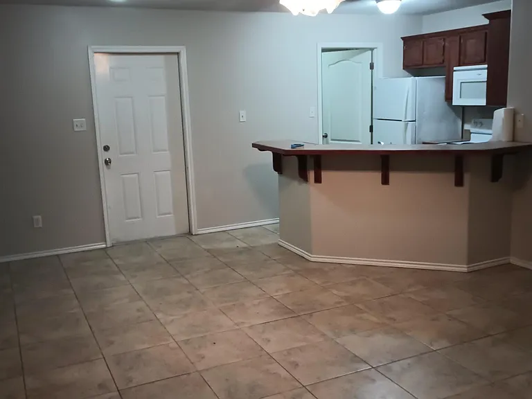 open concept living, dining, kitchen. separate laundry room