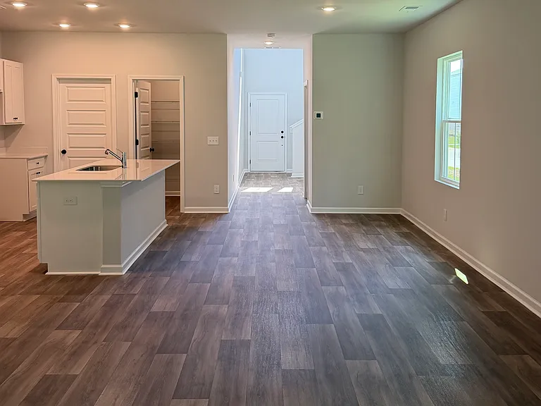 Open concept main floor with large kitchen pantry, laundry/mudroom with direct access to garage