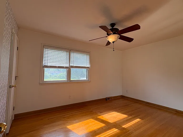 Primary Bedroom w/ Hardwood Floors