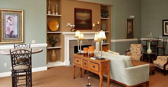 Elegant clubhouse with seat areas and complimentary Starbucks machine.